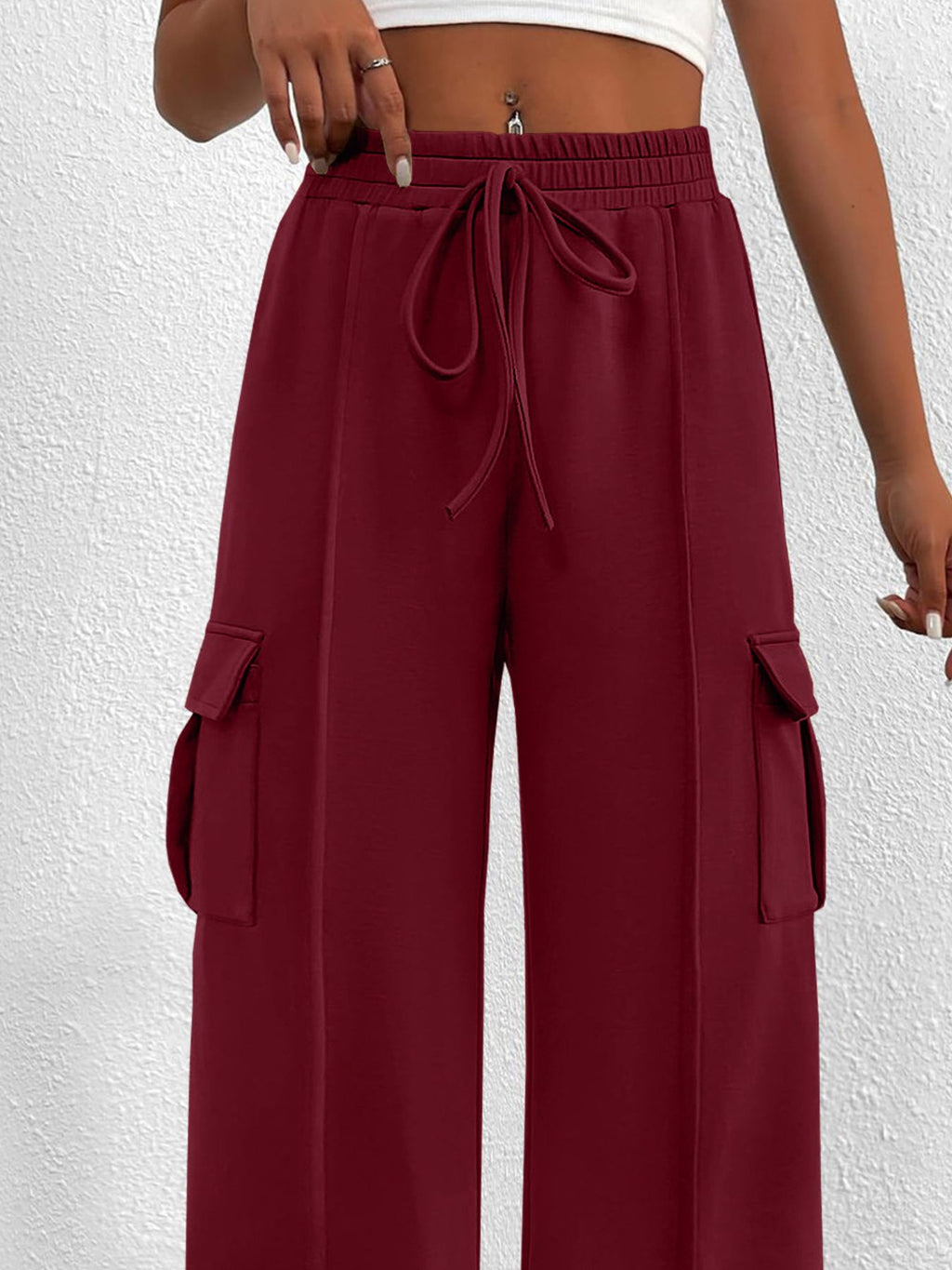 Women's high-waisted casual cargo pants with drawstring, lightweight utility pants from Trendsi, featuring multiple pockets and relaxed fit.