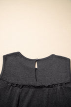 Macie a Line Tank Top by Threaded Pear, a sleeveless casual top with a fitted silhouette and stylish design, shown on a model.