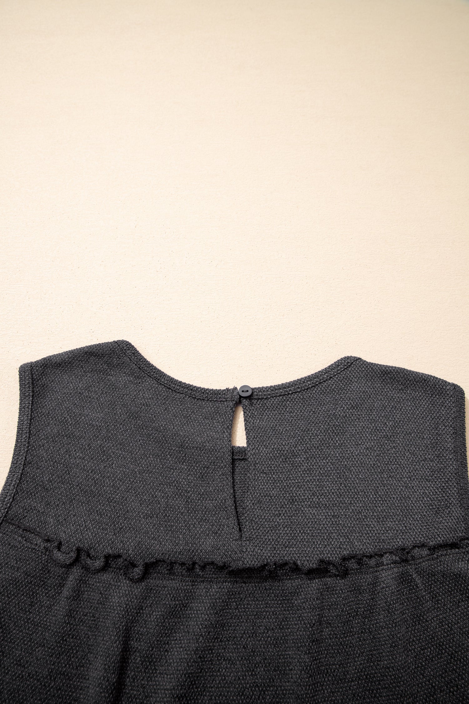 Macie a Line Tank Top by Threaded Pear, a sleeveless casual top with a fitted silhouette and stylish design, shown on a model.