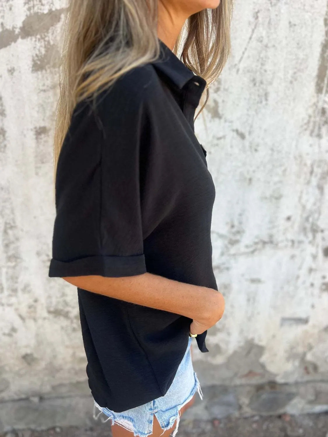 Women's collared half sleeve button-down blouse by Trendsi, featuring a sophisticated office shirt style with a classic collar.