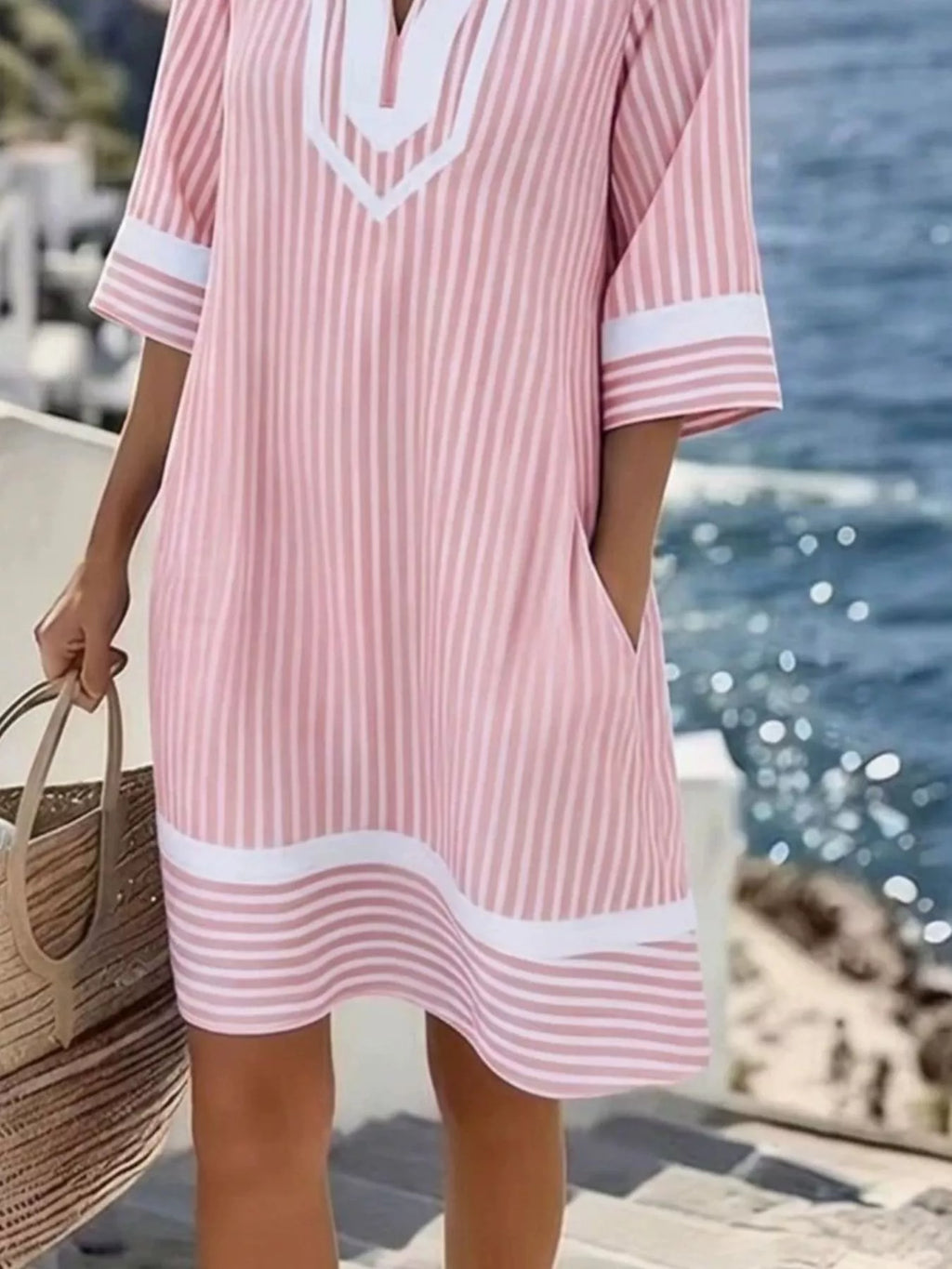 Plus size striped V-neck casual dress by Shopimist, full-length view showing relaxed fit and colorful horizontal stripes.