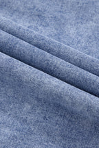VYSN raw hem button-down long sleeve denim dress displayed on a hanger, showcasing the casual style and raw hem detail.