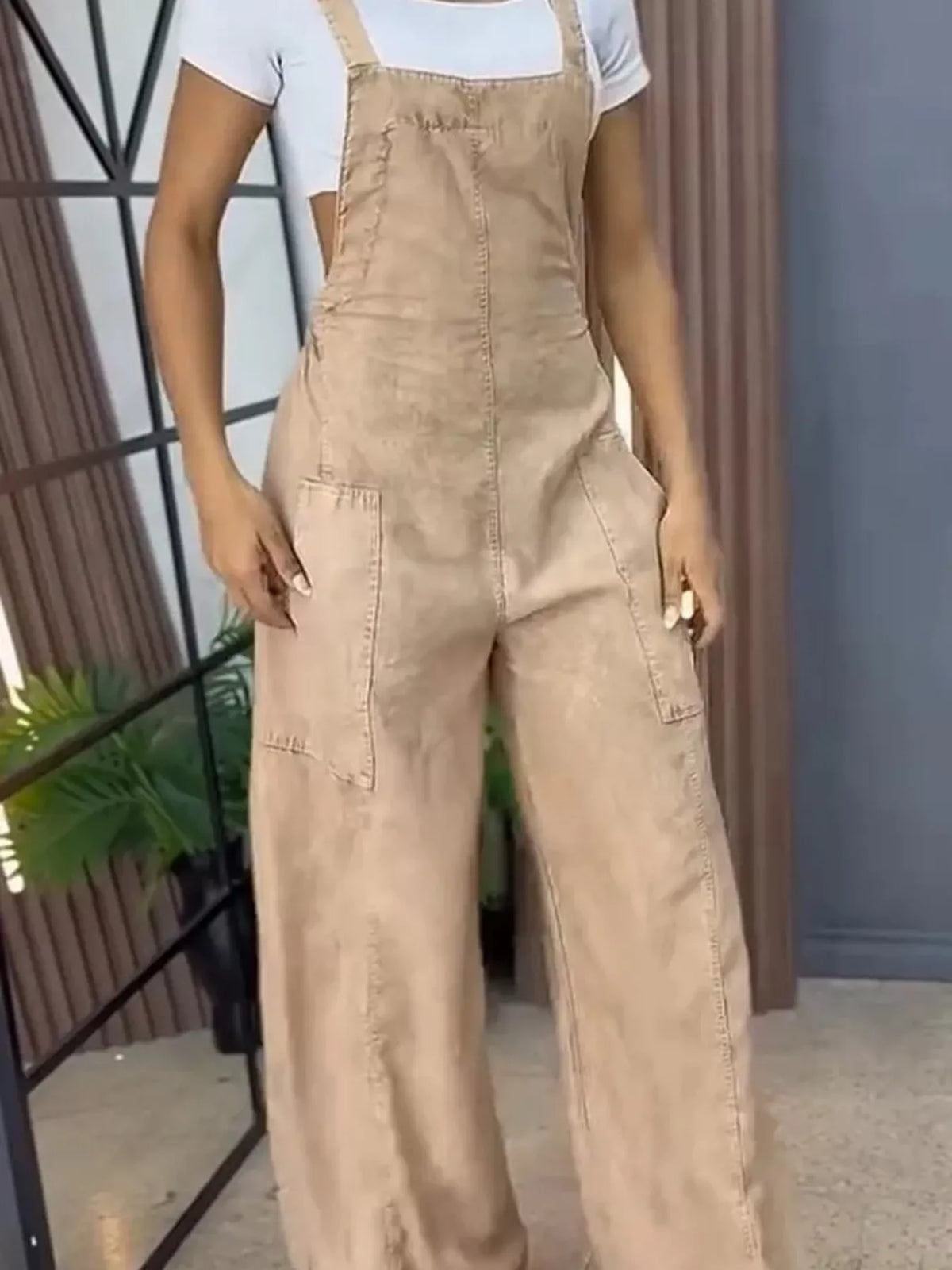 Blue wide-leg denim overalls by Plush Fashion Hub, full-size one-piece jumpsuit with relaxed fit and adjustable straps.