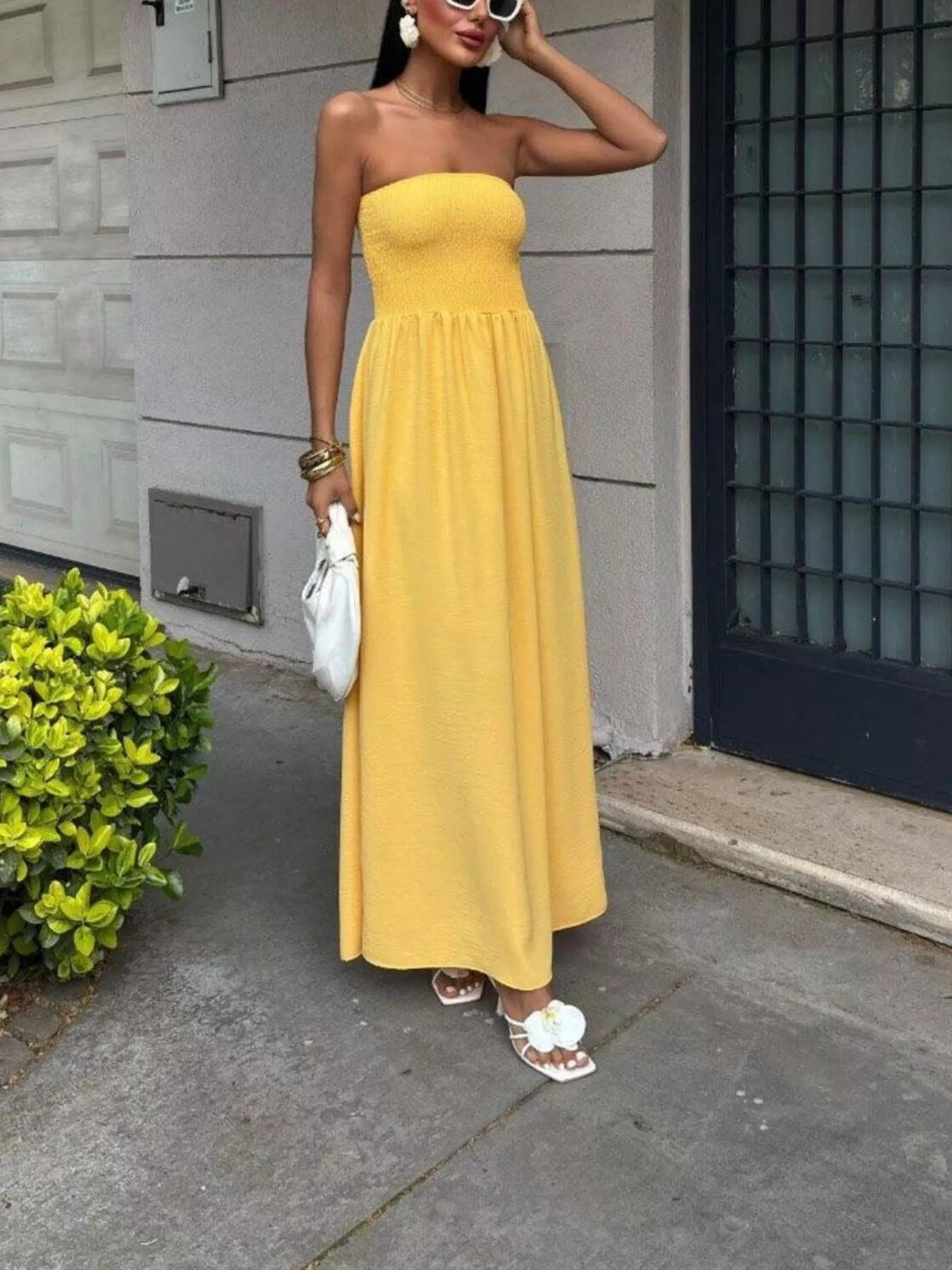 Plush Fashion Hub strapless smocked maxi dress with a flowy silhouette and floral pattern, perfect for summer occasions.