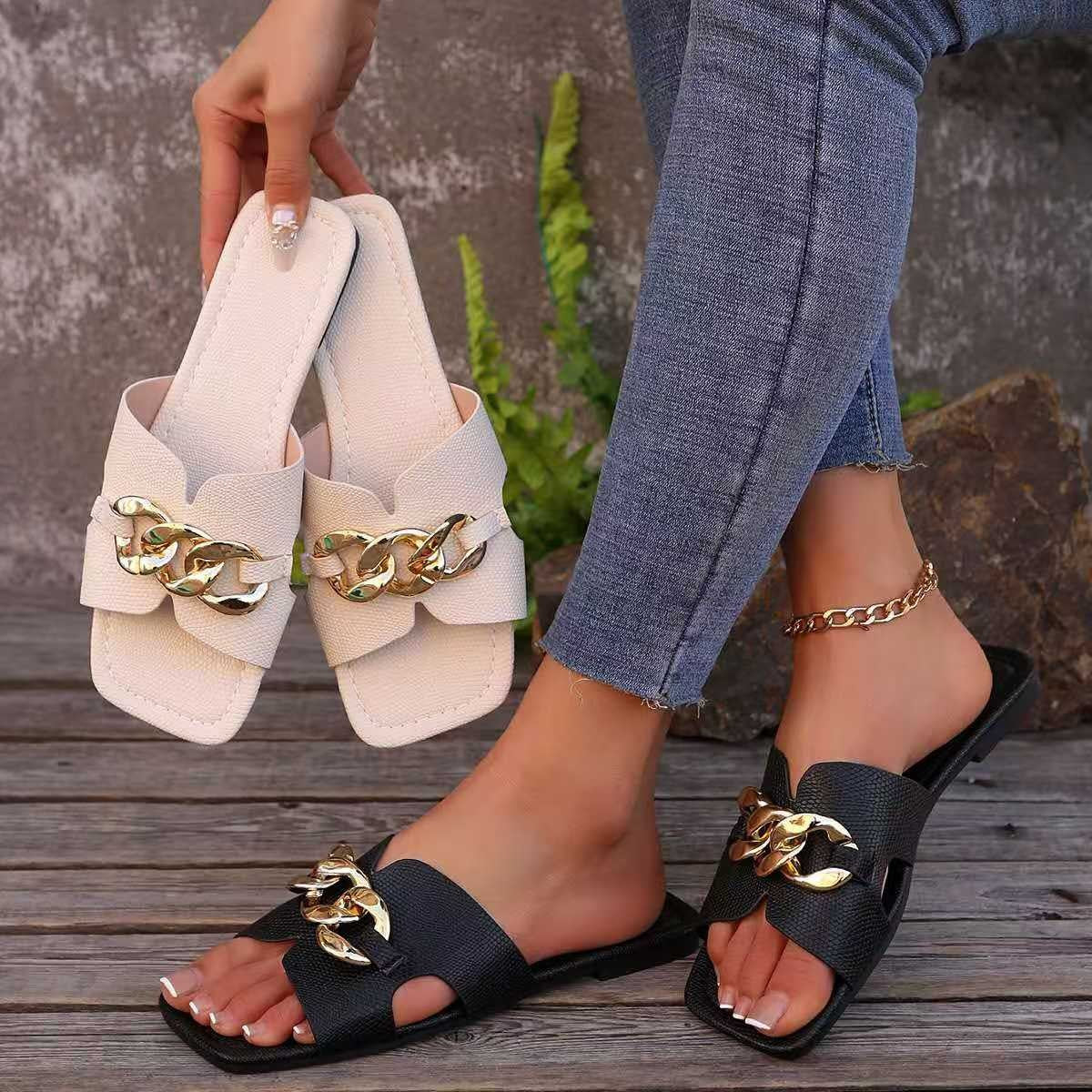Chain embellished slide sandals in neutral tones from Plush Fashion Hub, featuring a comfortable slip-on design and decorative chain details.