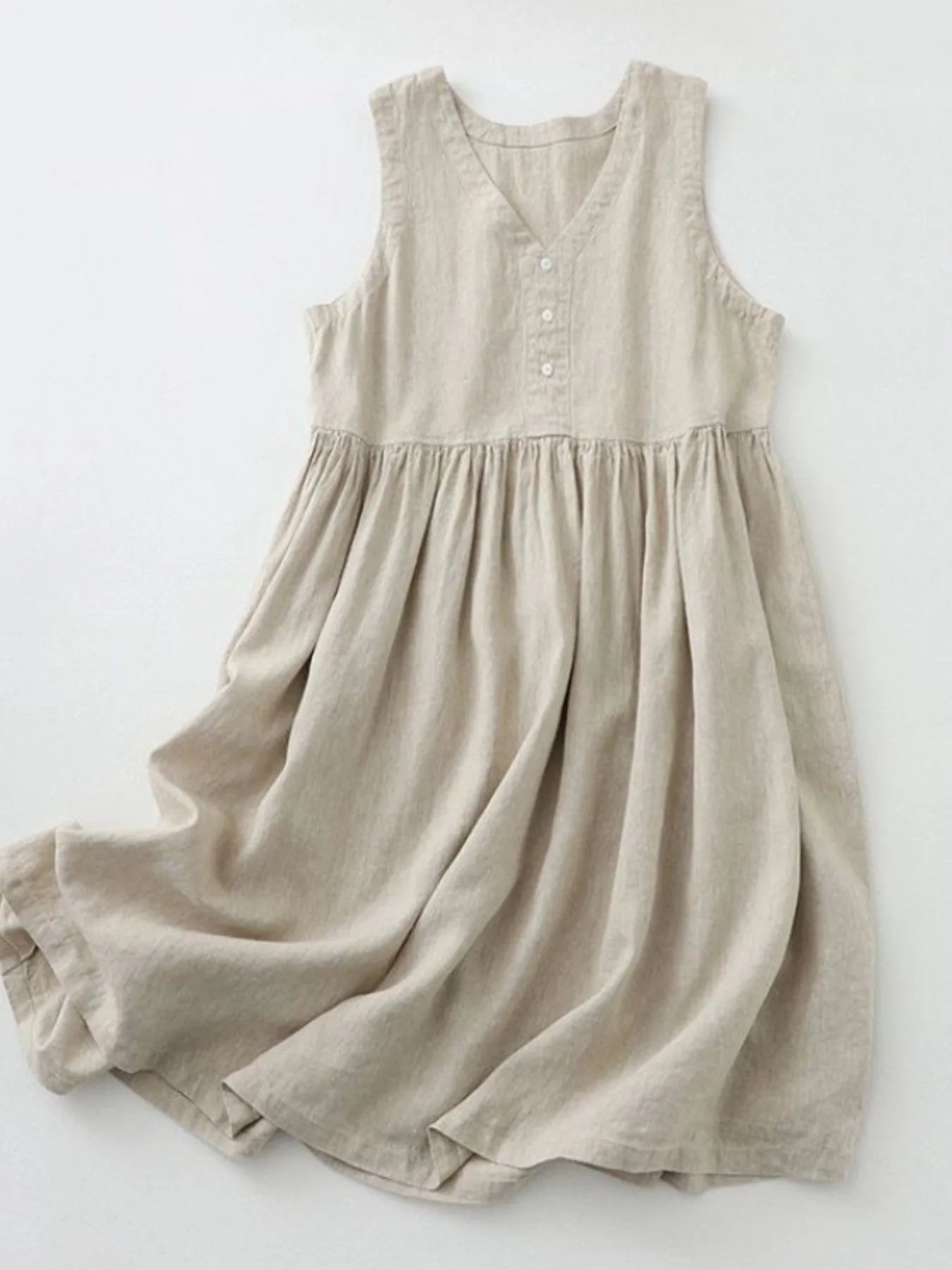 Women's V-neck sleeveless midi dress by Trendsi, made of 100% cotton with button details, casual style perfect for warm weather.