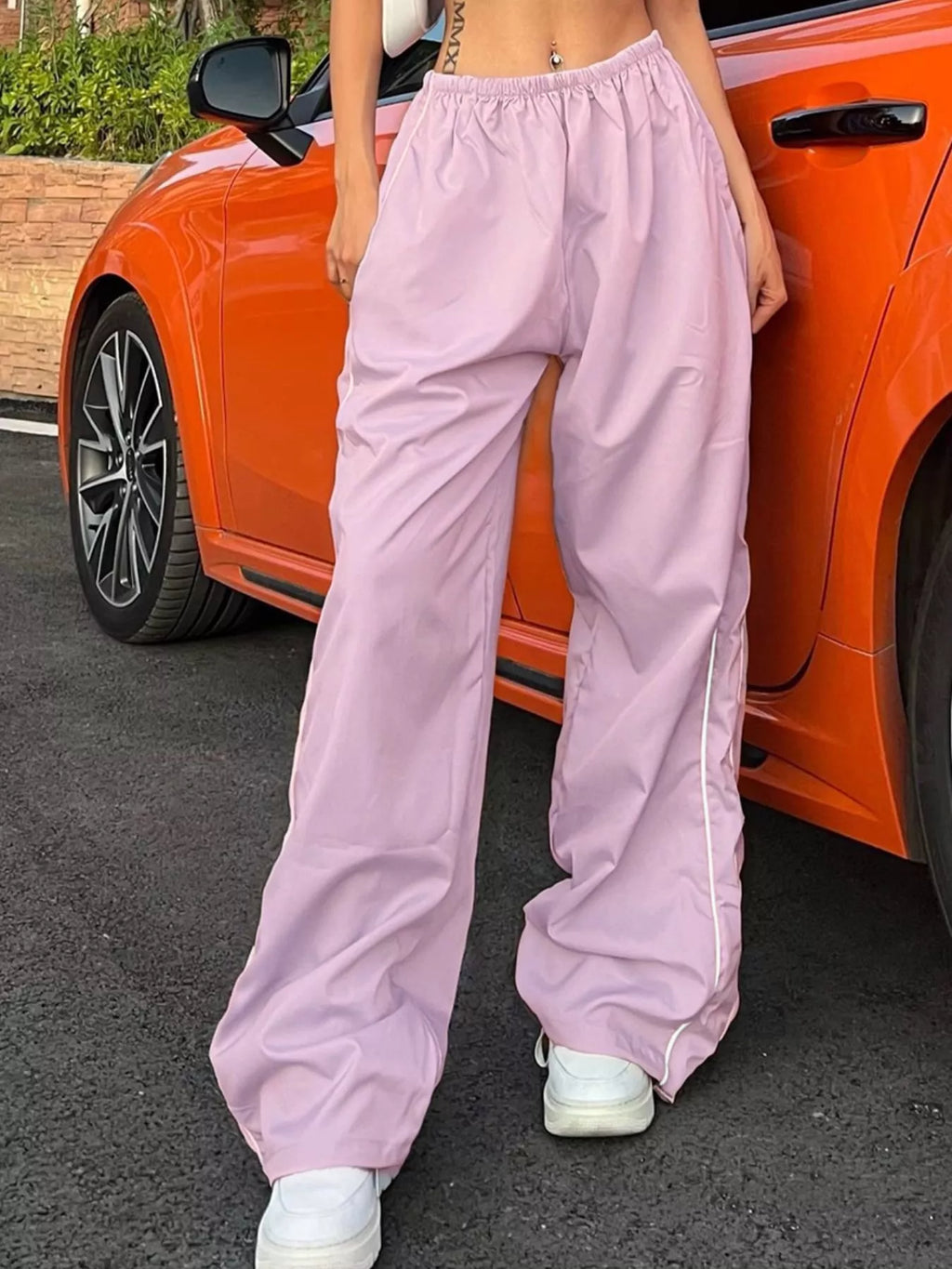 Women's high-rise wide-leg trousers with lightweight fabric and elastic waist, perfect for casual or dressy outfits.
