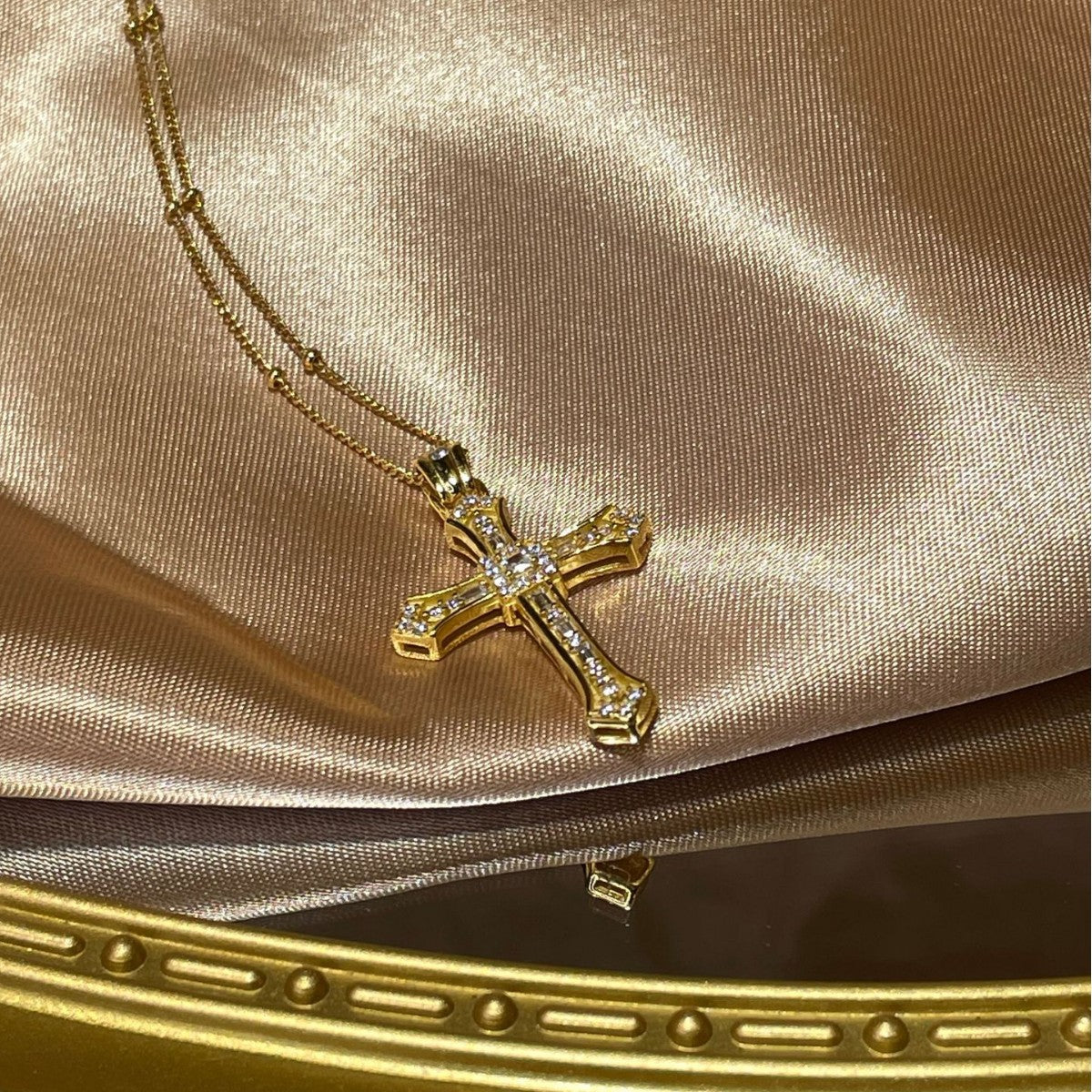 Gold-plated cross pendant necklace from Plush Fashion Hub, featuring a detailed cross charm on a delicate chain.