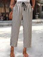 Women's striped high-waisted cropped pants with pockets from Plush Fashion Hub, showing the stylish design and fit.