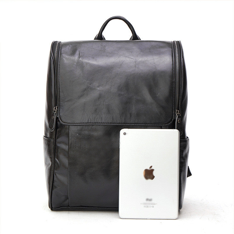 Black leather computer backpack with plush finish from Plush Fashion Hub, featuring multiple compartments and adjustable straps.
