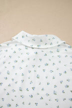 Floral print half zip top and matching shorts from Shopimist, casual summer set with vibrant flower pattern.