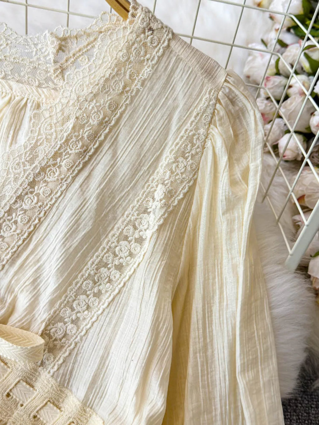 Lace detail V-neck blouse dress from Trendsi, featuring elegant fabric and feminine design, suitable for casual or dressy occasions.