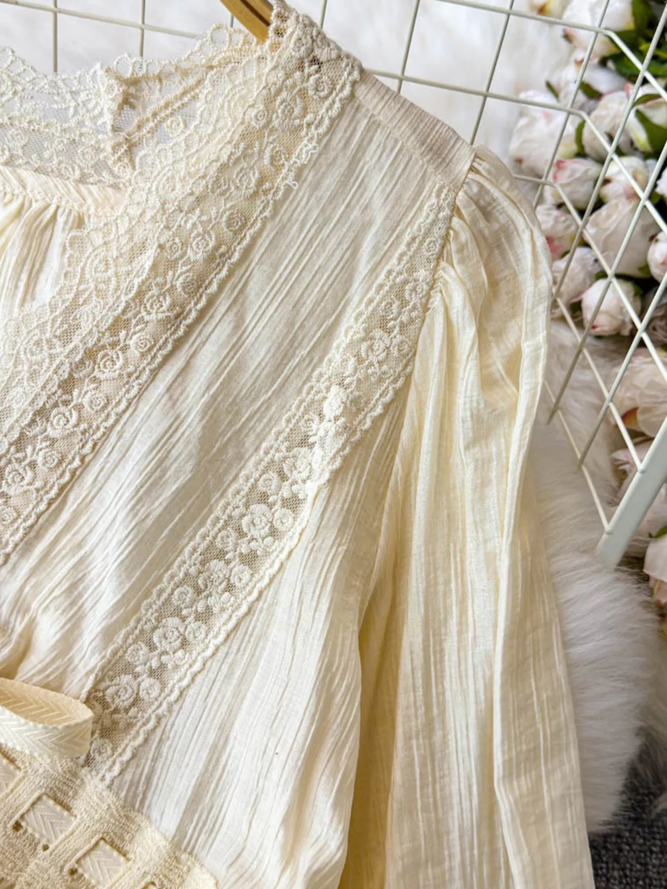 Lace detail V-neck blouse dress from Trendsi, featuring elegant fabric and feminine design, suitable for casual or dressy occasions.