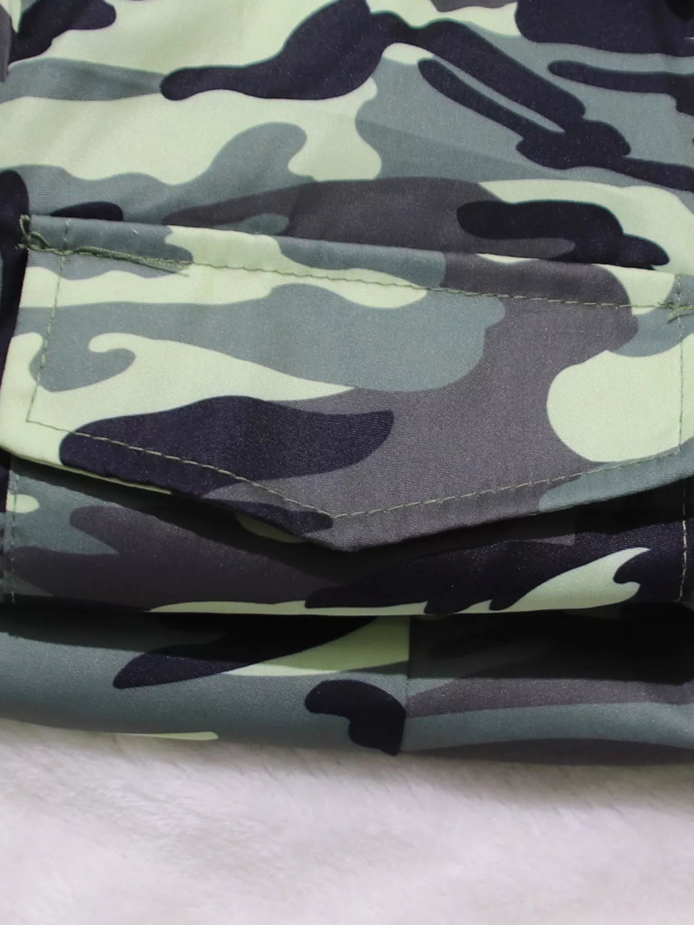 Camouflage button front tie waist romper by Shopimist, featuring a stylish tie belt and short sleeves, perfect for casual wear.