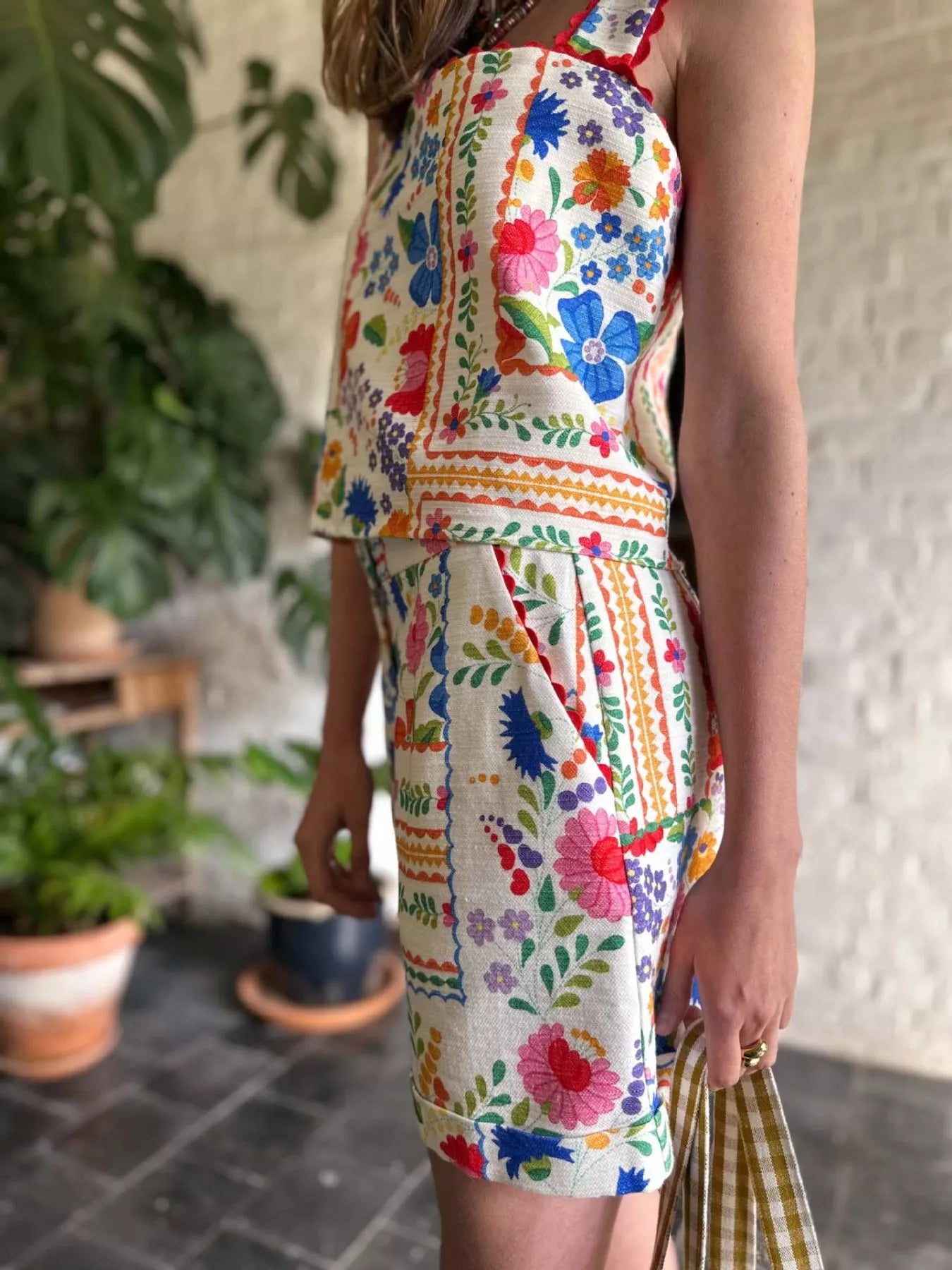 Floral print cami top and decorative pocket shorts set by Shopimist, featuring a vibrant floral design and comfortable fit.