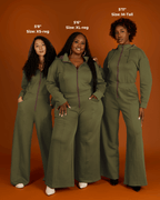 Green satin-lined jumpsuit by Plush Fashion Hub, featuring a sleek design and stylish fit, shown on a model.