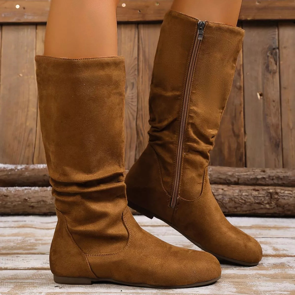 Round toe side zip boots by Trendsi featuring a stylish design with a side zipper and comfortable round toe silhouette.