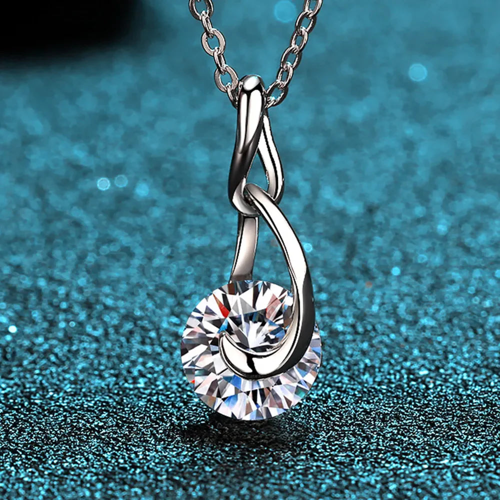925 sterling silver moissanite necklace with a 2-carat central stone, featuring a delicate chain and elegant jewelry design.