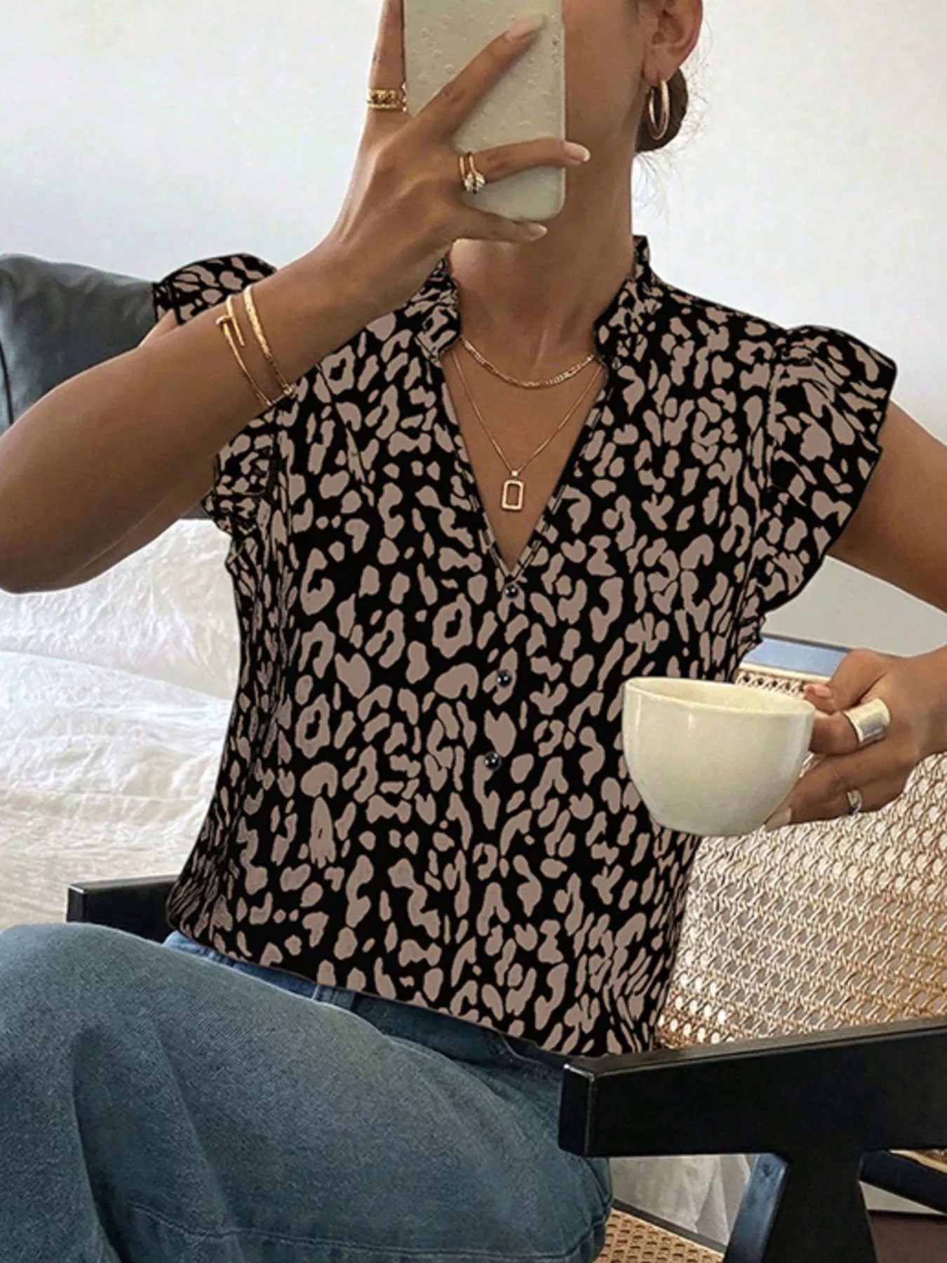 Leopard print ruffle sleeve blouse from Plush Fashion Hub, showcasing stylish feminine design and bold animal print details.