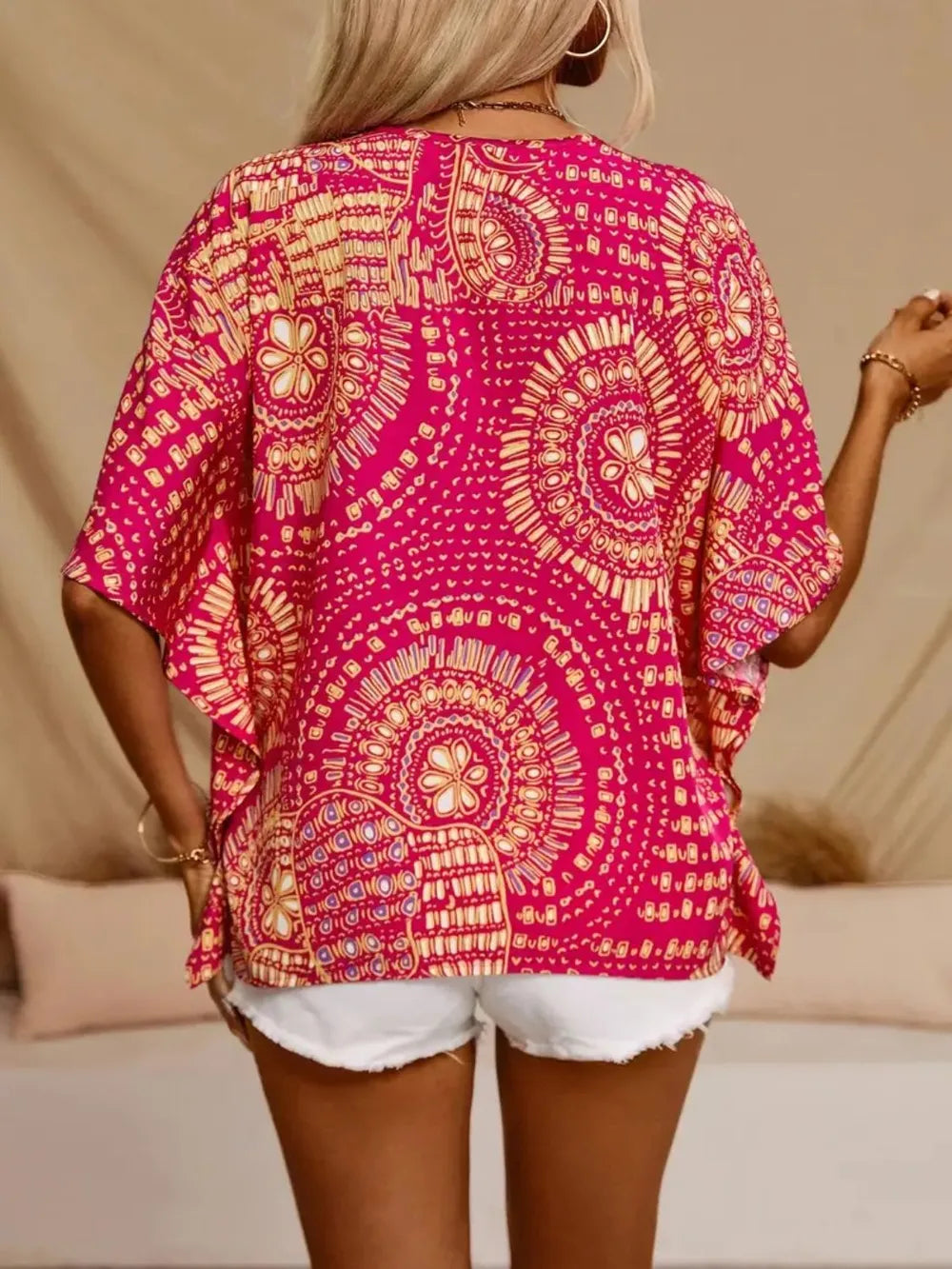 Women's printed V-neck half sleeve casual top by Plush Fashion Hub, featuring soft stretch fabric and a stylish office blouse design.