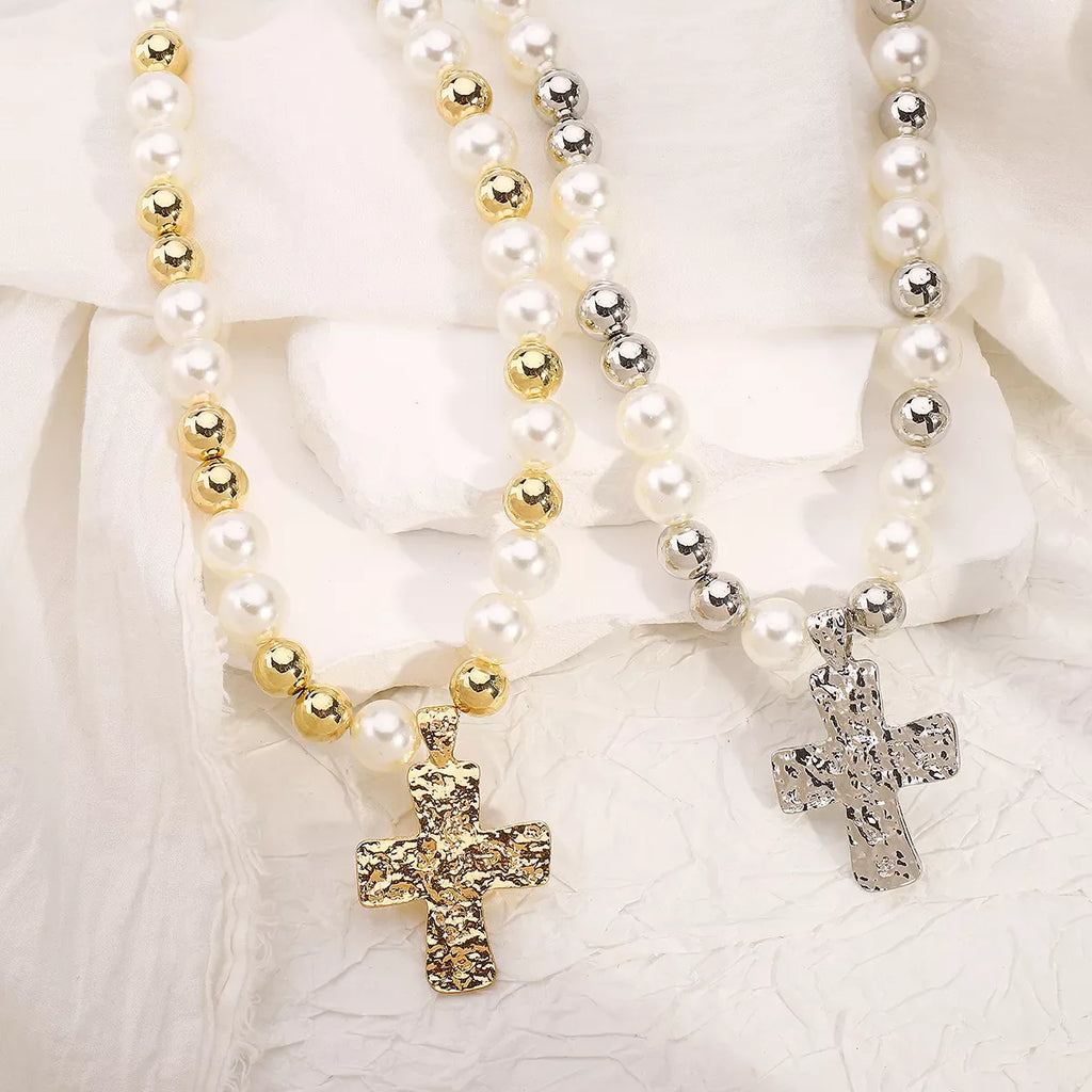 Pearl and cross pendant necklace featuring a white pearl and silver cross, stylish jewelry accessory by Shopimist.