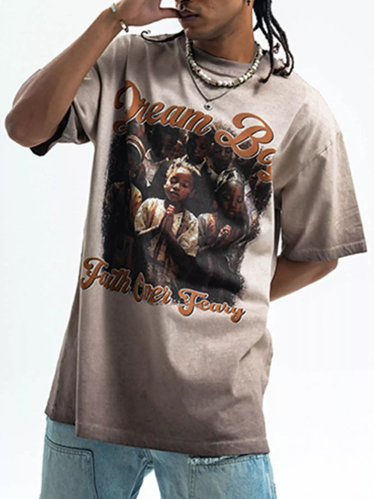 Men's graphic round neck short sleeve T-shirt by Trendsi, featuring a colorful design on soft cotton fabric.