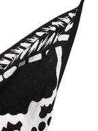 Women's printed halter neck maxi dress with tie-back detail from Plush Fashion Hub, flowing fabric and vibrant pattern.