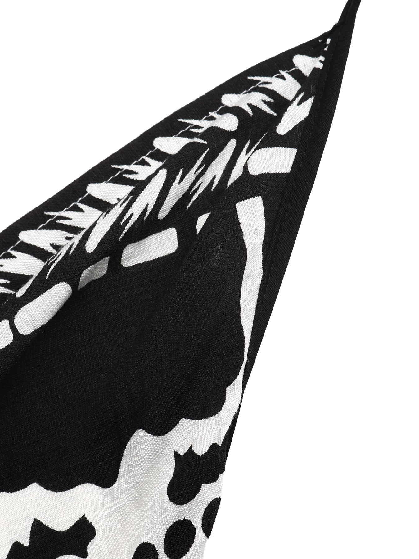 Women's printed halter neck maxi dress with tie-back detail from Plush Fashion Hub, flowing fabric and vibrant pattern.