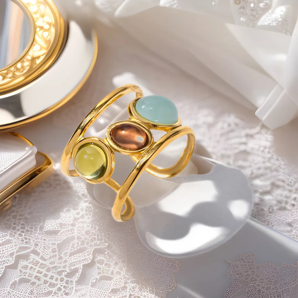 18K gold-plated gemstone open cuff ring with intricate design and vibrant gemstone accents, stylish jewelry accessory.