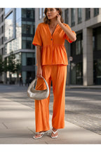 Women's V-neck loose short-sleeve top and wide-leg pants set by FitiqueFit, casualwear with comfortable, relaxed fit.