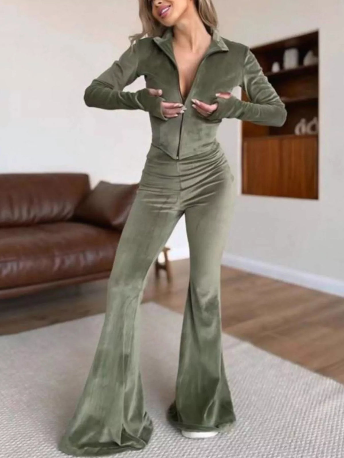 Trendsi zip-up crop top and flared pants two-piece set, stylish and coordinated outfit, shown on a mannequin.