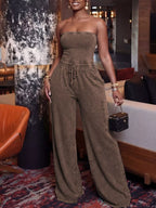 Strapless wide-leg jumpsuit with drawstring waist from Plush Fashion Hub, shown in a stylish, relaxed fit with a modern silhouette.