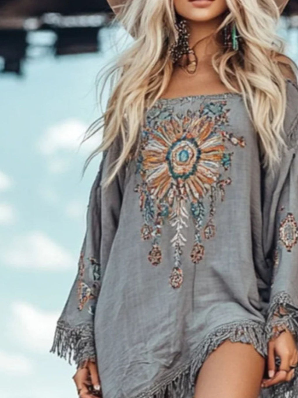 Elegant chic fringe hem long sleeve mini dress by Trendsi, perfect for cocktail parties, featuring stylish design and flowing fabric.