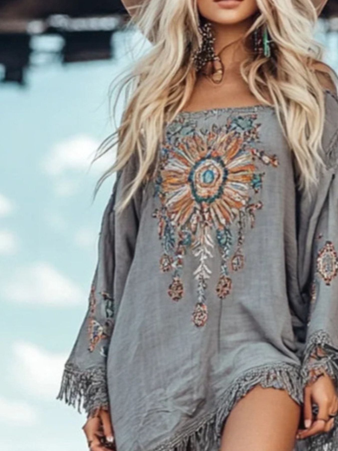 Elegant chic fringe hem long sleeve mini dress by Trendsi, perfect for cocktail parties, featuring stylish design and flowing fabric.
