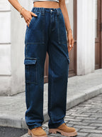 High-waisted cargo denim jeans from Plush Fashion Shop with multiple pockets and a relaxed fit, displayed on a white background.