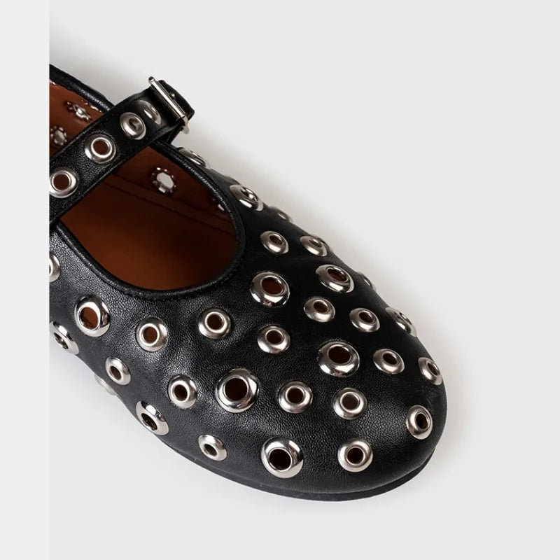 Plush Fashion Hub riveted round toe Mary Jane flats with strap, black leather upper, and low heel on a neutral background.