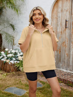Grey half-zip short sleeve hooded top by Trendsi, featuring a casual fit and lightweight fabric, perfect for layering or everyday wear.
