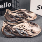 Trendsi hollow-out flat sandals with open toe design and minimalist style, featuring cut-out details on the footwear.