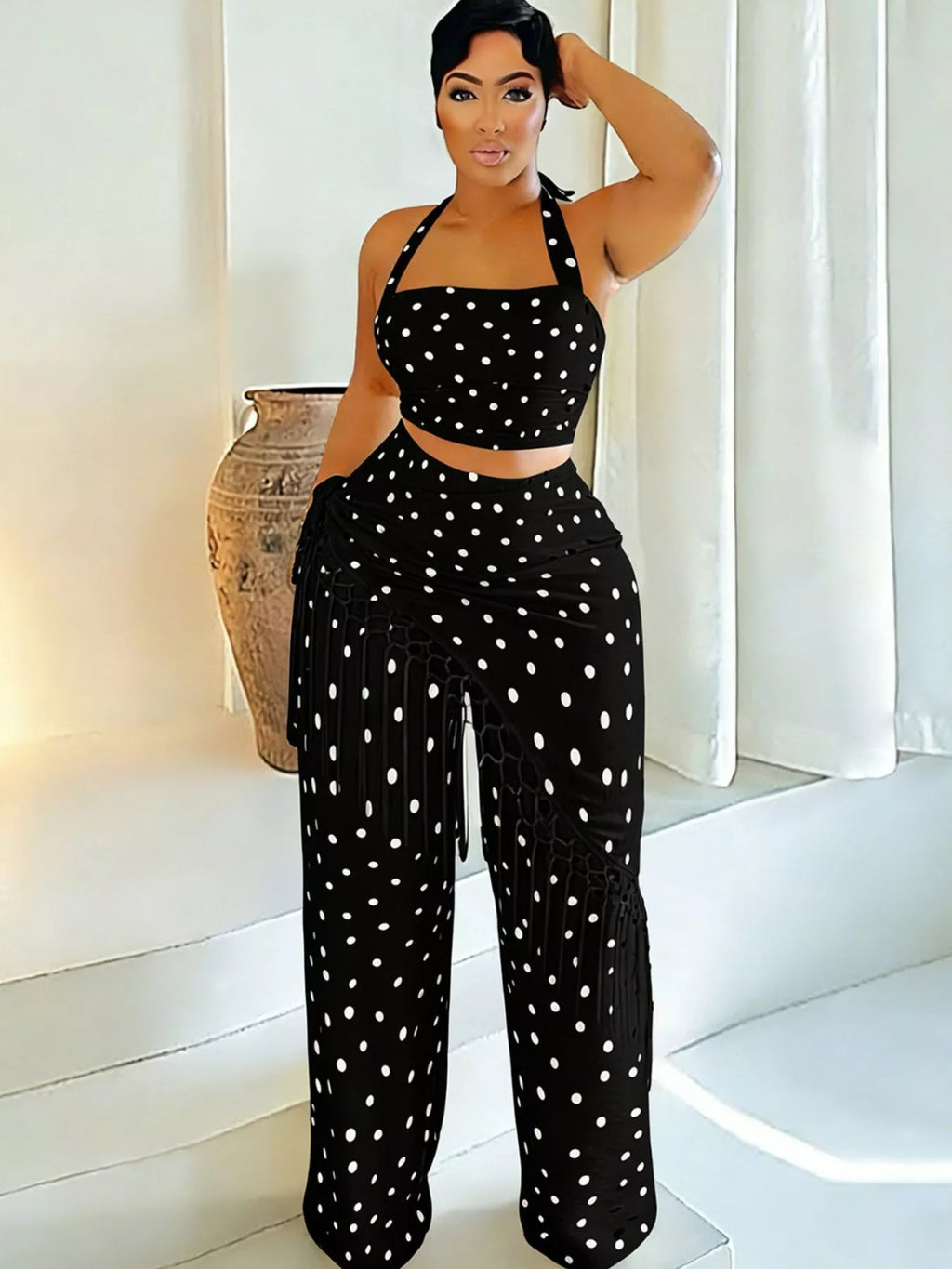 Polka dot halter neck cami with fringe trim pants set featuring rings from Trendsi, styled for a trendy summer look.