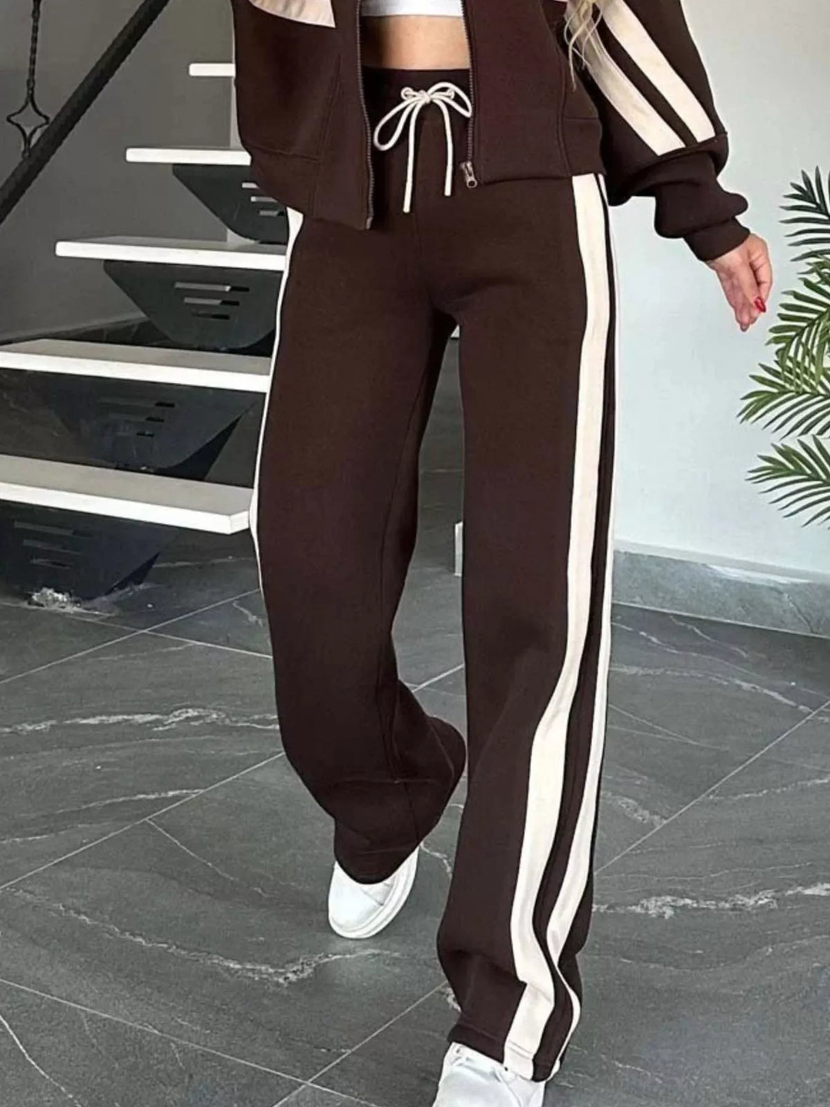 Plus size contrast stripe zip-up jacket and matching pants from Plush Fashion Hub activewear set, shown in stylish athletic wear ensemble.