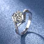Sterling silver moissanite ring with 1-carat center stone, showcasing a sparkling, elegant design.
