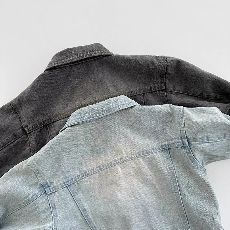 Two denim jackets in dark grey and light blue, shown from the back with visible collars and seam details.