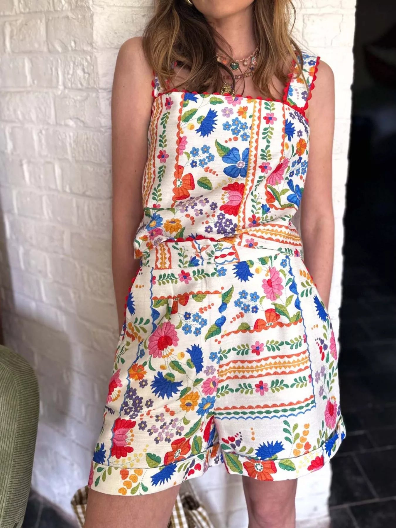 Floral print cami top and decorative pocket shorts set by Plush Fashion Hub, featuring a vibrant floral design and casual fit.