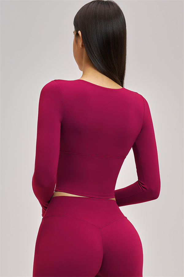 Long sleeve crop top from Plush Fashion Hub's The Swoon collection, featuring a fitted design and stylish details.