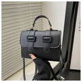 Stylish small square LadyShow.Store crossbody bag with versatile design and underarm carry style, shown in black with gold accents.