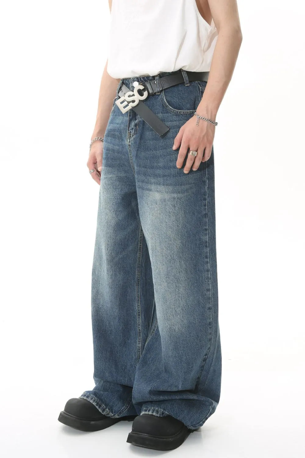 Wide leg denim jeans with pockets by Plush Fashion Hub, showing the relaxed fit and stylish design in a natural pose