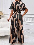 Abstract print wide-leg jumpsuit by Trendsi, featuring bold patterns and flowing wide-leg design, perfect for stylish summer wear.
