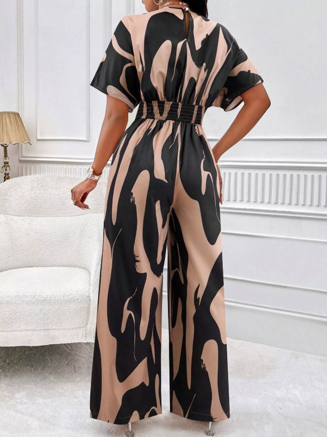Abstract print wide-leg jumpsuit by Trendsi, featuring bold patterns and flowing wide-leg design, perfect for stylish summer wear.