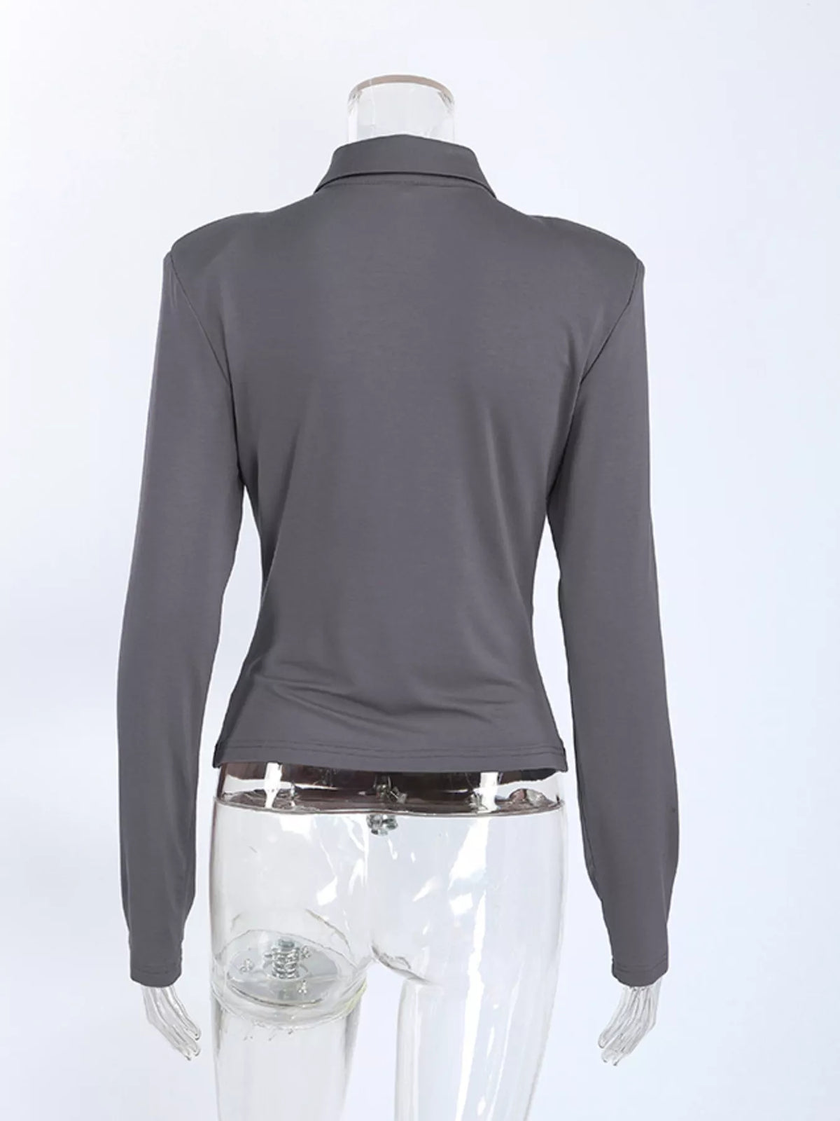 Slim-fit long-sleeve T-shirt with cutout detail from Trendsi, featuring a modern design and fitted silhouette.