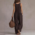 Women’s loose fit V-neck sleeveless wide-leg jumpsuit by Plush Fashion Hub, casualwear with relaxed fit and stylish design.